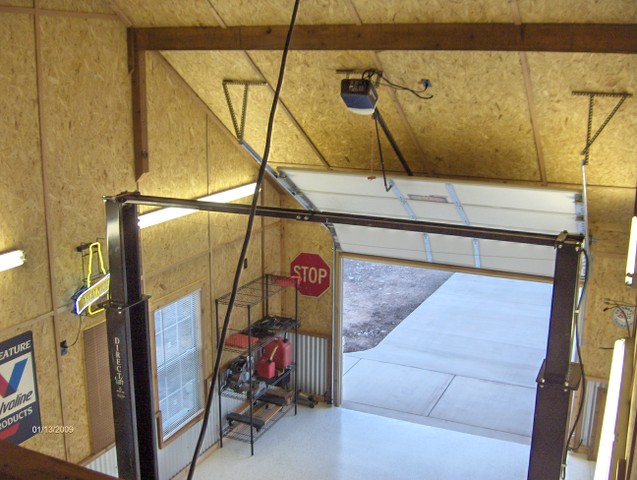 Can I install a garage door opener on a sloped ceiling?