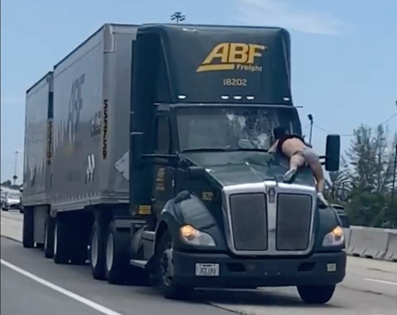 I-95 Florida man takes 9-mile turnpike ride on hood of a tractor semi truck hood